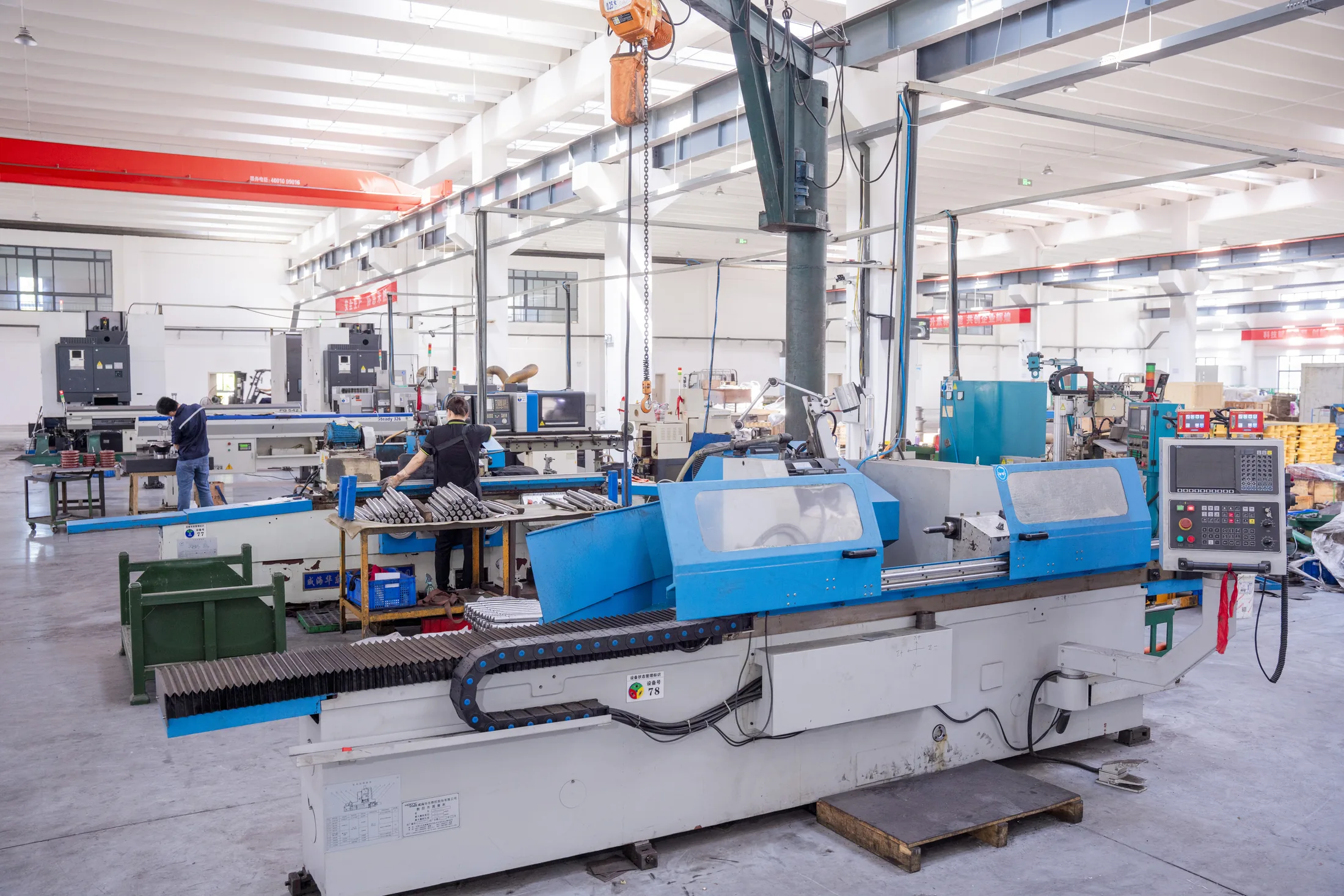 Row of slant-bed CNC lathes